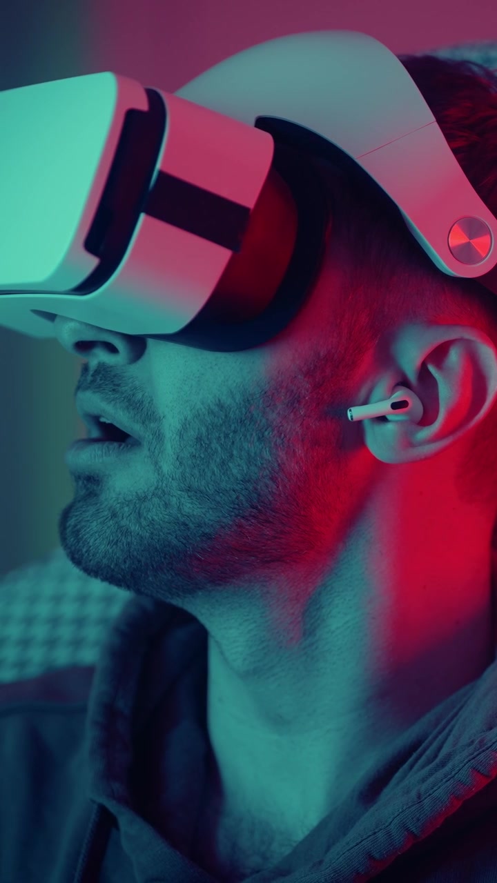 Amazed Man Experiencing Virtual Reality with Neon Lights