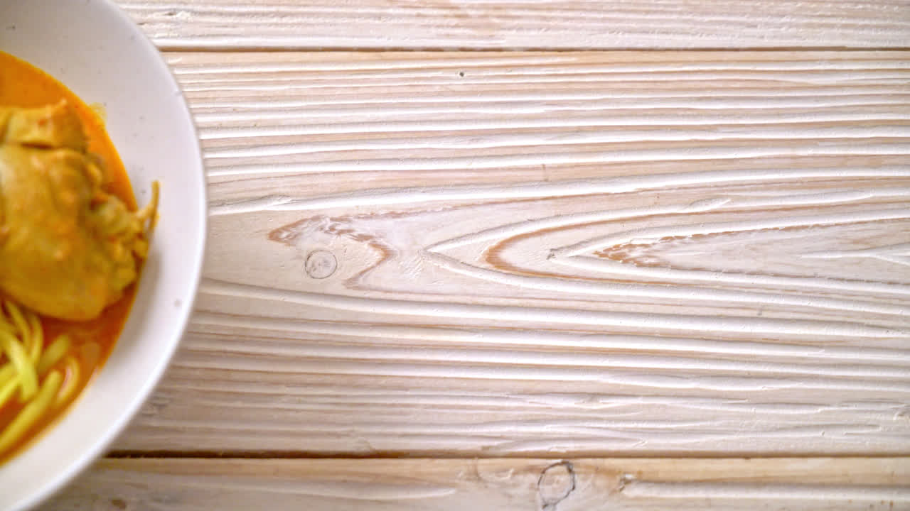 Northern Thai noodle curry soup with chicken (Kao Soi Kai) - Thai food style