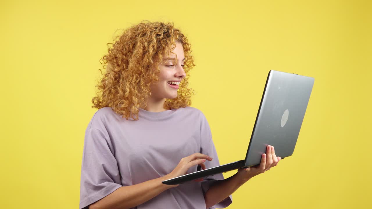 Surprised woman looking at laptop screen