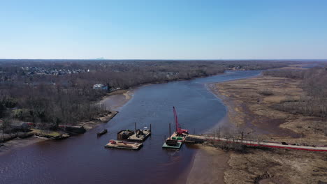 an aerial shot over a construction site in a creek