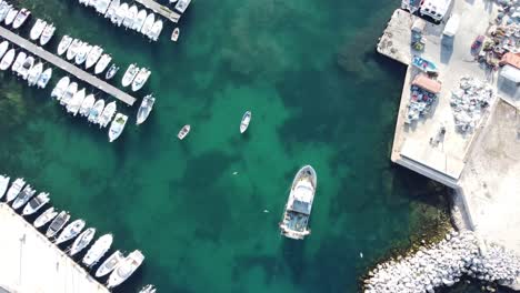 Cinematic-overhead-4K-drone-clip-of-boats-and-yachts-inside-a-marina-in-the-port-de-Carro-in-Martigues-commune,-France