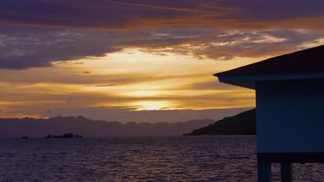 peaceful view of sunrise stilt house island resort timelapse static 4k