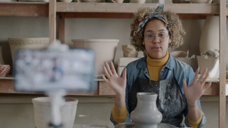 Woman Demonstrating Pottery Techniques on Video
