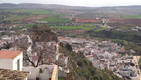 Stunning-view-over-rural-European-countryside-from-above-with-hills-and-white-houses