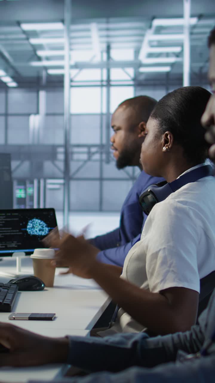 Vertical video Admin in data center drinking coffee and implementing AI systems