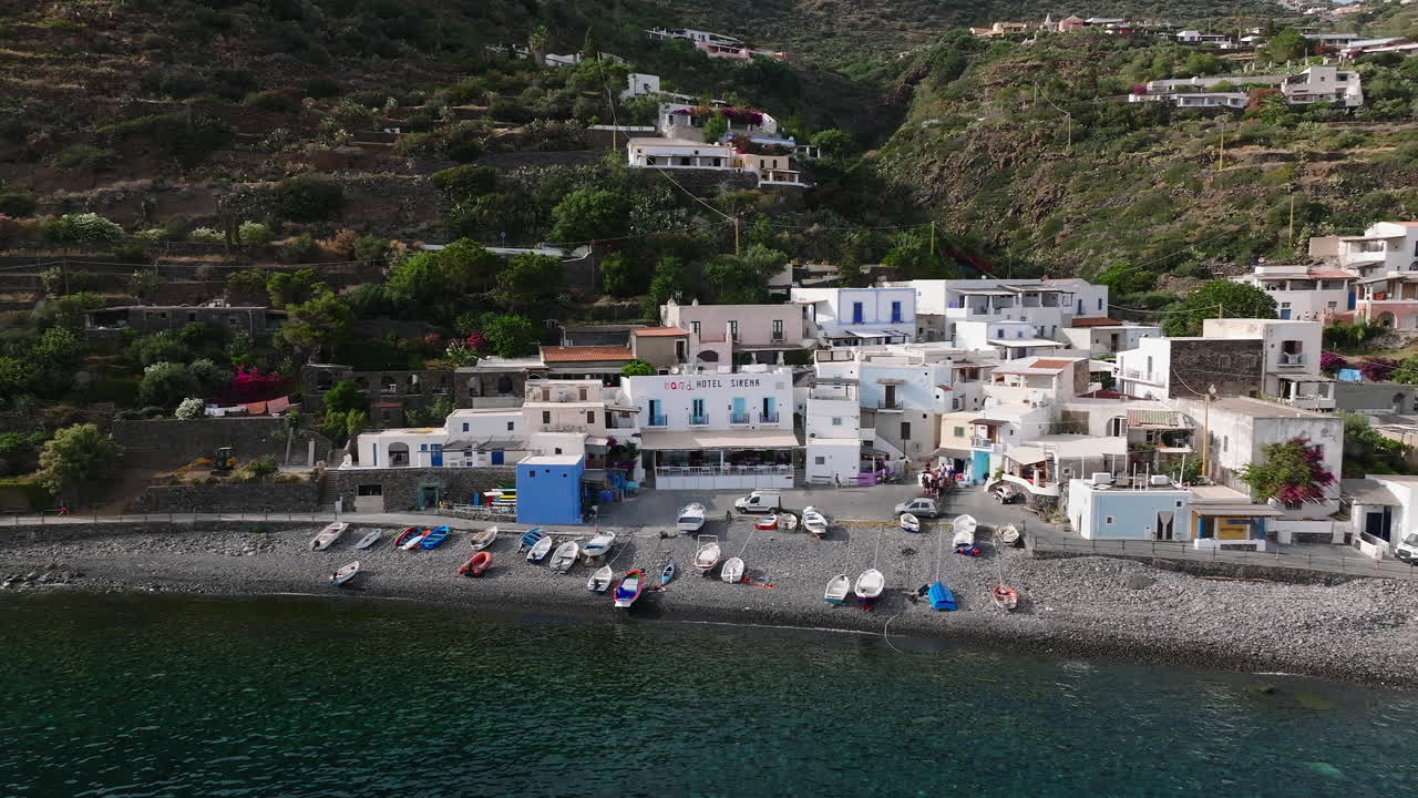 4K Aerial of Filicudi volcanic island. Slow descend over town, Italy