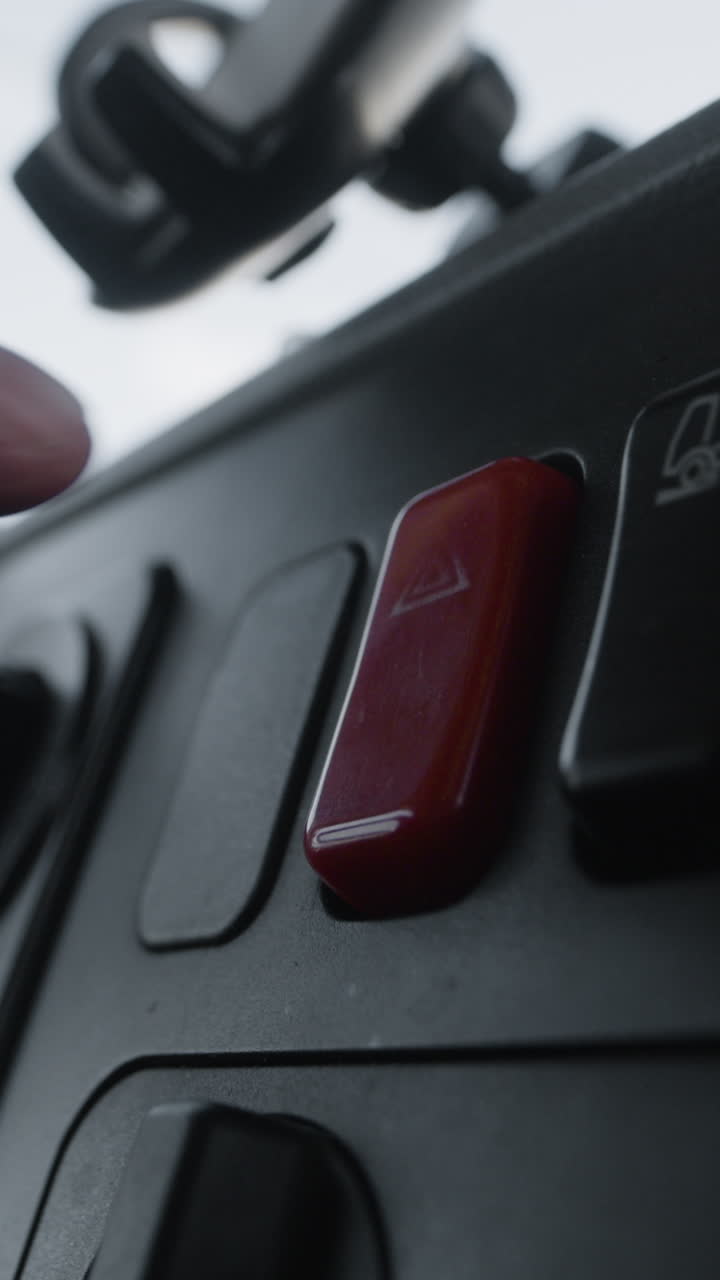 Close-up of a red toggle switch on a control panel
