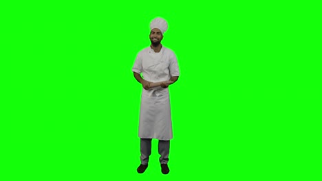 Portrait-of-male-chef-holding-rolling-pin