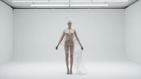 a translucent vision: a model graces the stage in an ethereal, sheer ensemble, showcasing the harmony of fashion and elegance against a minimalist backdrop