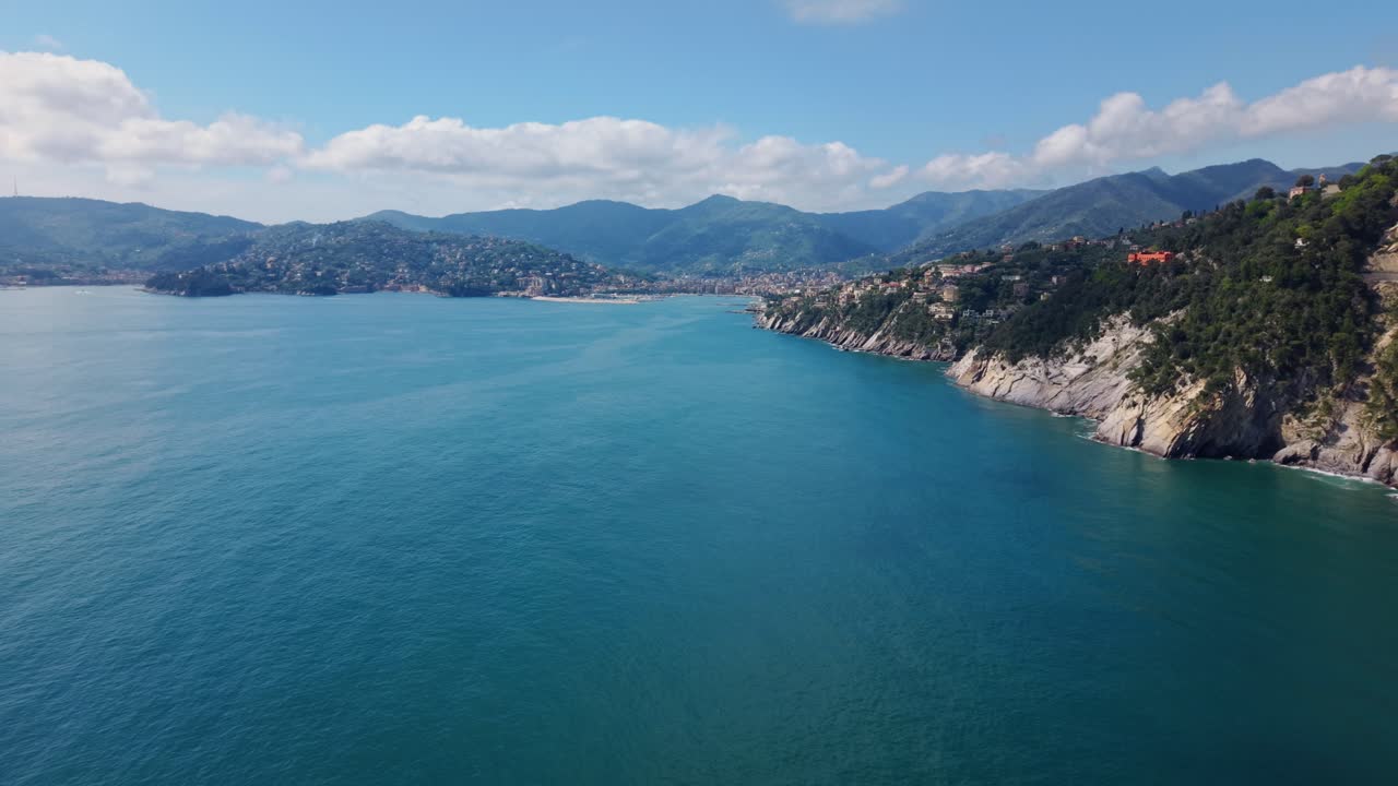 A coastal italian town by the mediterranean sea showcasing stunning cliffs and clear water, aerial view
