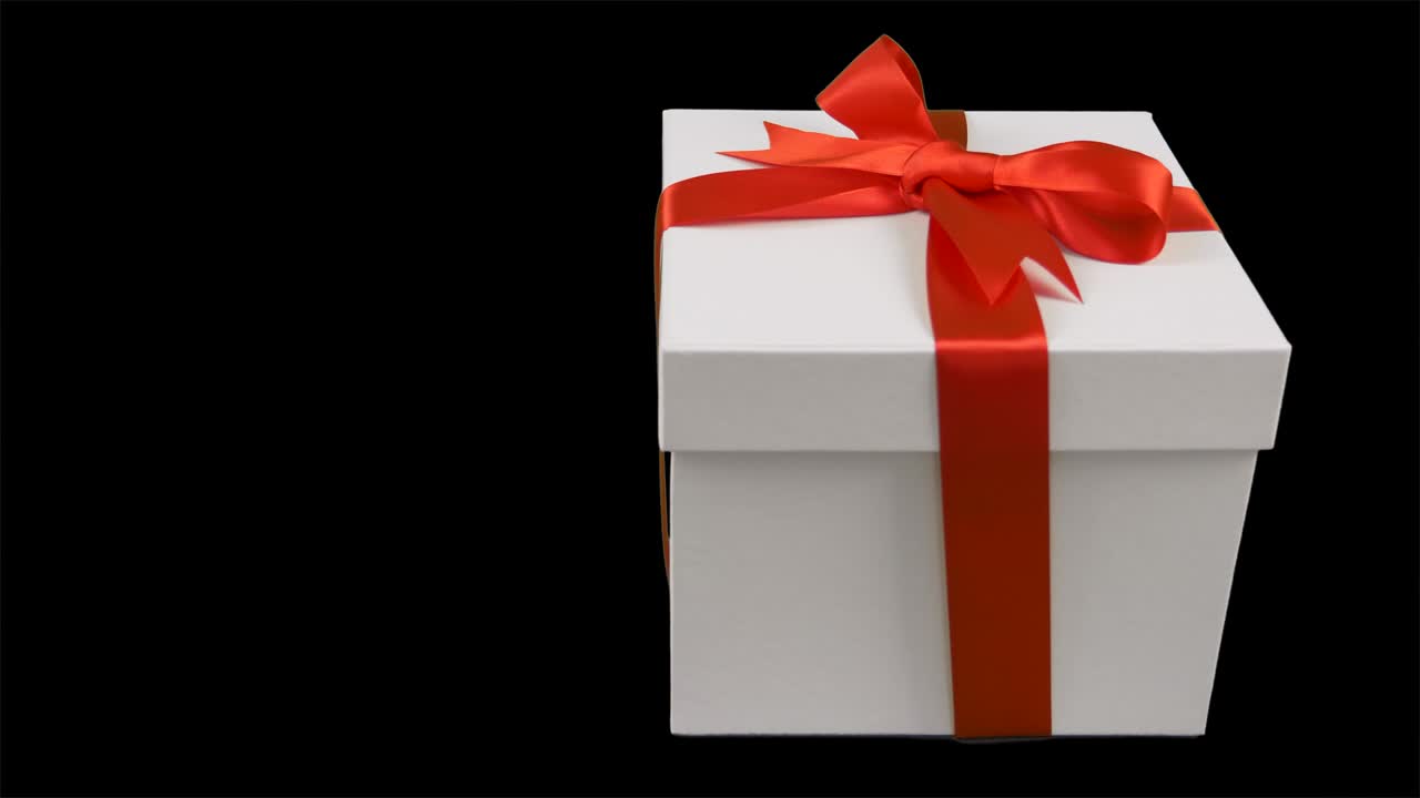 белая подарочная коробка с красной лентой лук поворачивает на прозрачном фоне. альфа-канал хрома ключ прозрачный фон. есть пустое пространство для текста. пан.