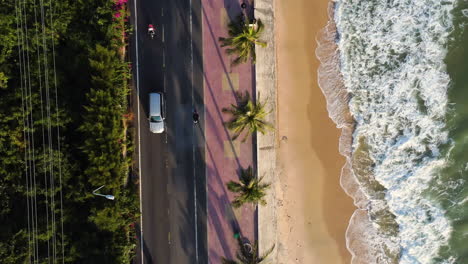 aerial flying over scenic coastal road at golden hour