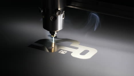 precision laser cutting a design into metal