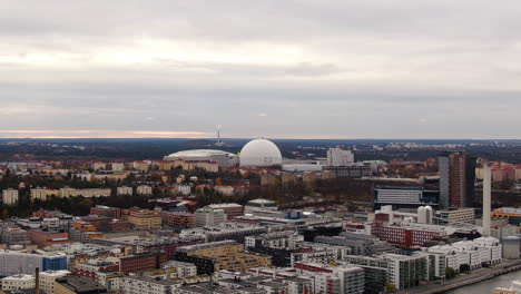 wide aerial slide showing stockholm skyline towards ericsson globe