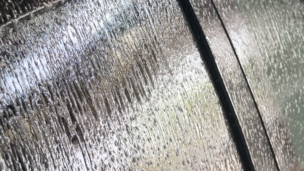 Water dripping on a glass surface