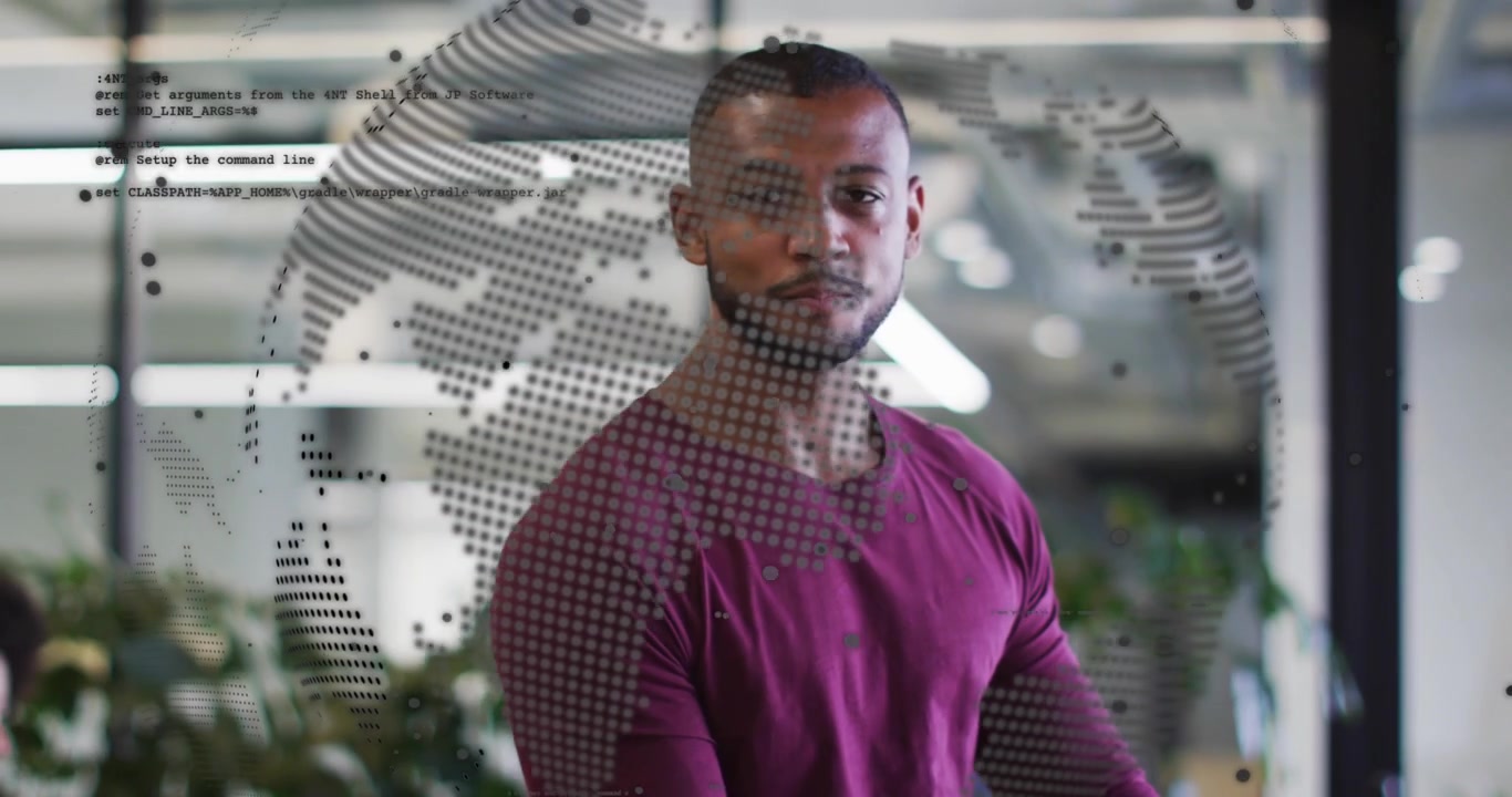 Man tapping tablet near glass wall, activating dotted globe overlay while reviewing business data
