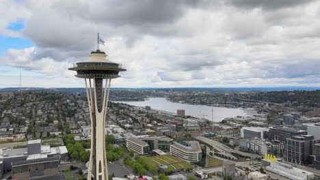 scenic views of the city, orbital drone footage near space needle tower in seattle, wa