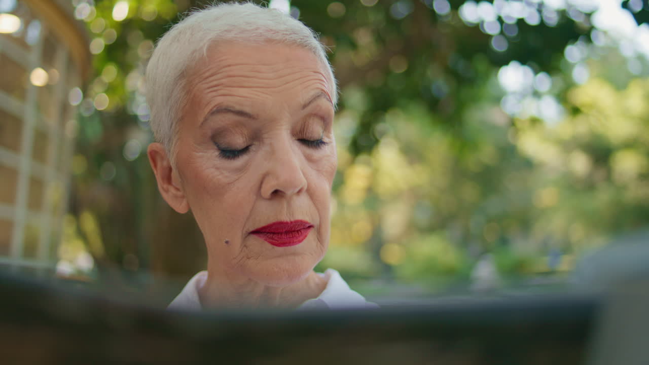 Confident businesswoman looking newspaper closeup. Elegant retired lady flipping