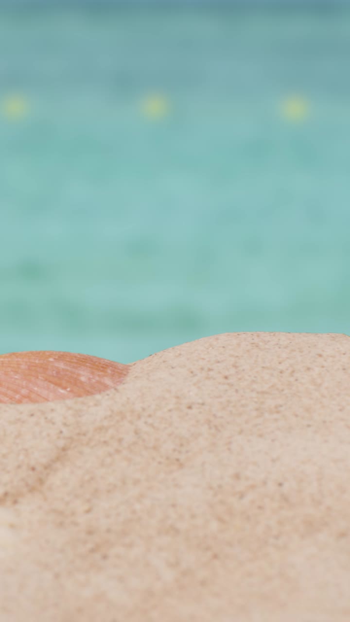 Vertical Video Summer Holiday Concept With Child's Bucket Spade On Sandy Beach Against Sea Background