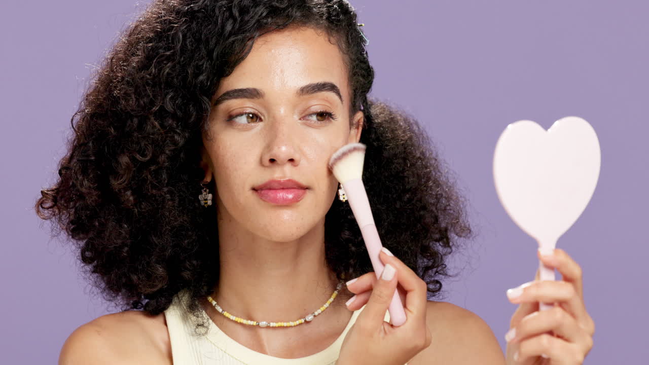Woman Applying Makeup with Brush and Mirror
