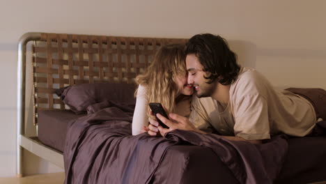 Happy-couple-on-bed