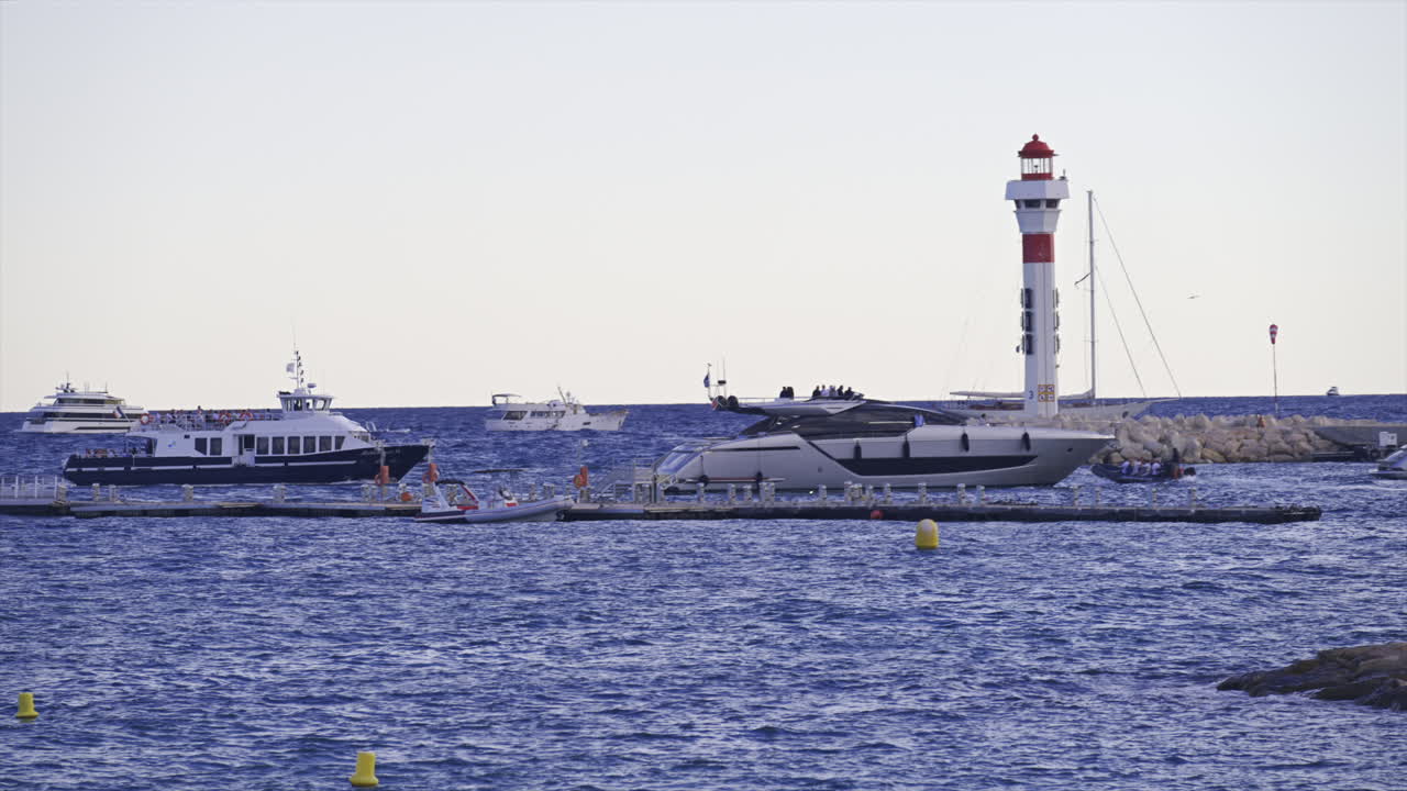 Cannes, France - June 22, 2025: Distant view of boats moving on the Mediterranean Sea in daylight