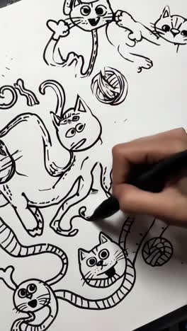 drawing playful cartoon cats