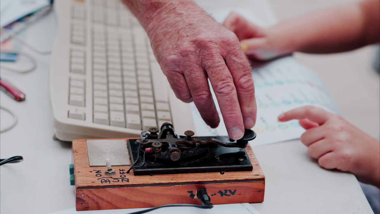 A man and a woman using a telegraph device with a decipher