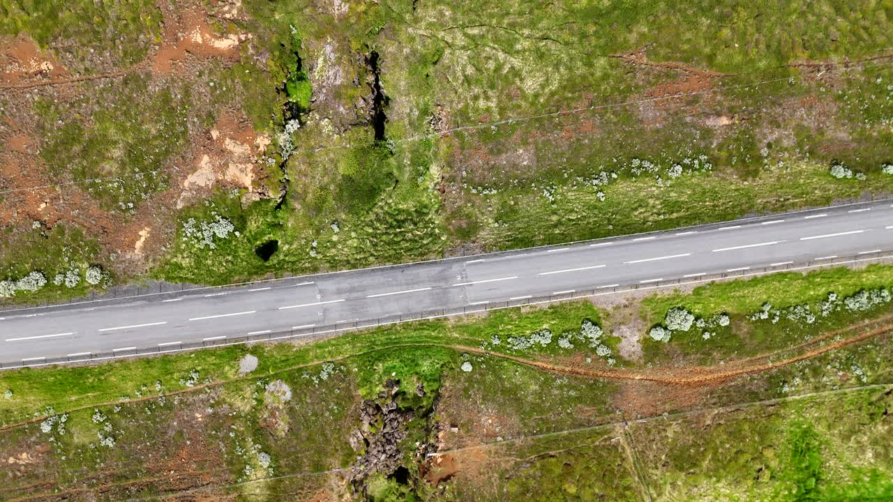 Aerial view of the northern Norðurland continental rift, showcasing rugged geology, plate cracks, and vast open terrain under bright light