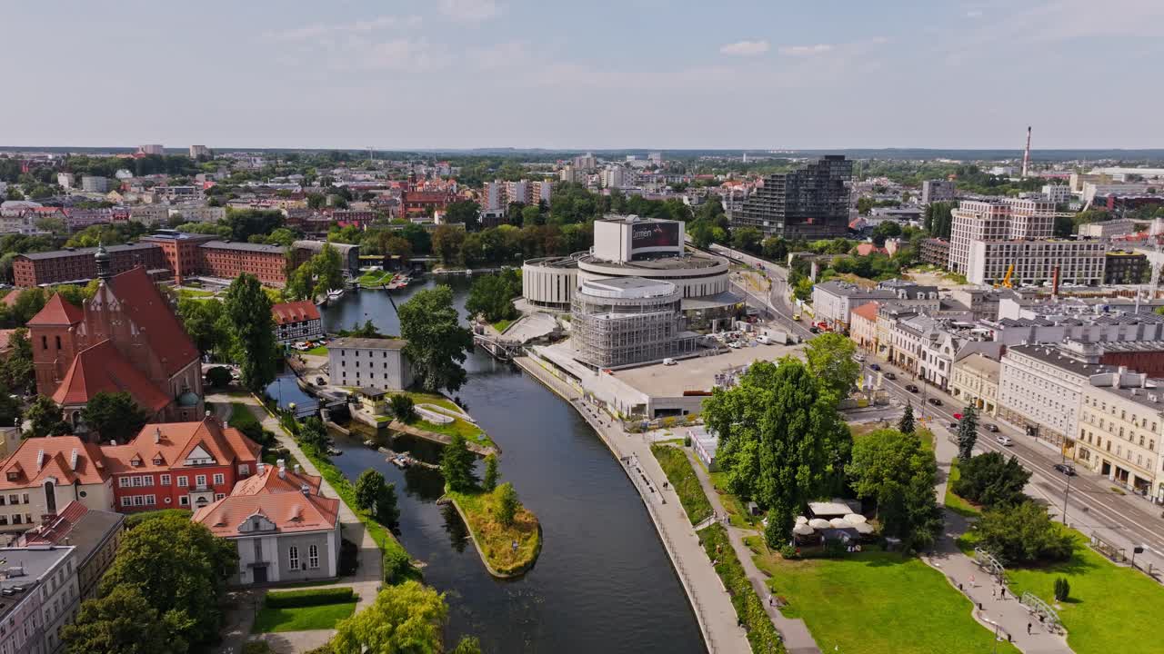 Drone establishing view fly towards Opera Nova Bydgoszcz Poland, river, old town