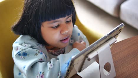 young girl using tablet