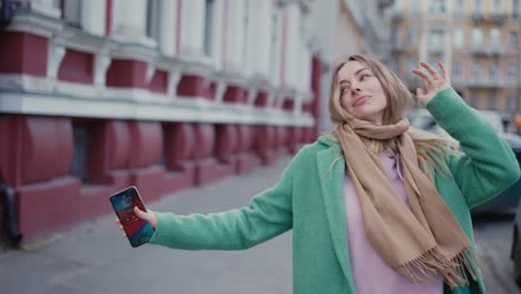 excited woman walking and dancing on the street