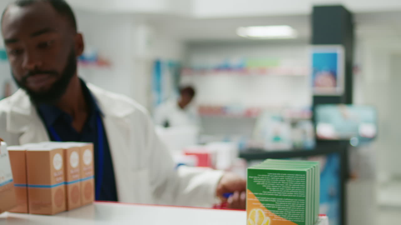 Pharmacist organizing medication boxes in a pharmacy
