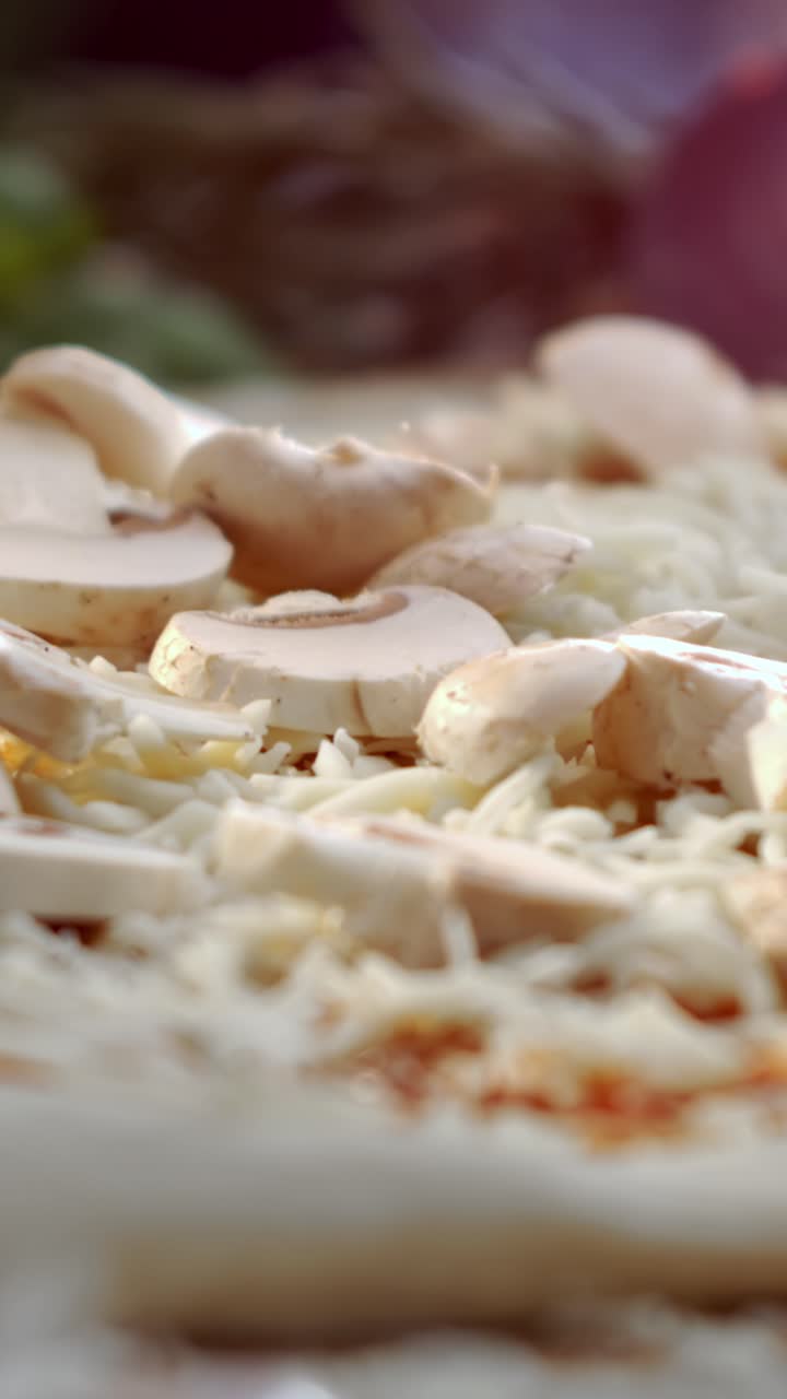 Pizza preparation with mushrooms and cheese