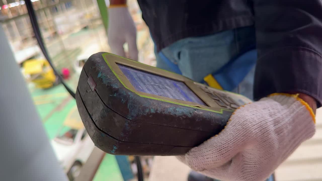 Hand of officer is holding gas analyzer reading oxygen and gas levels, ideal for safety inspection and industrial operations