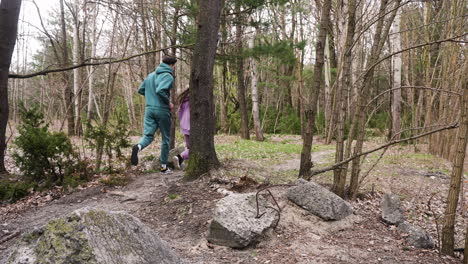 couple running in the forest