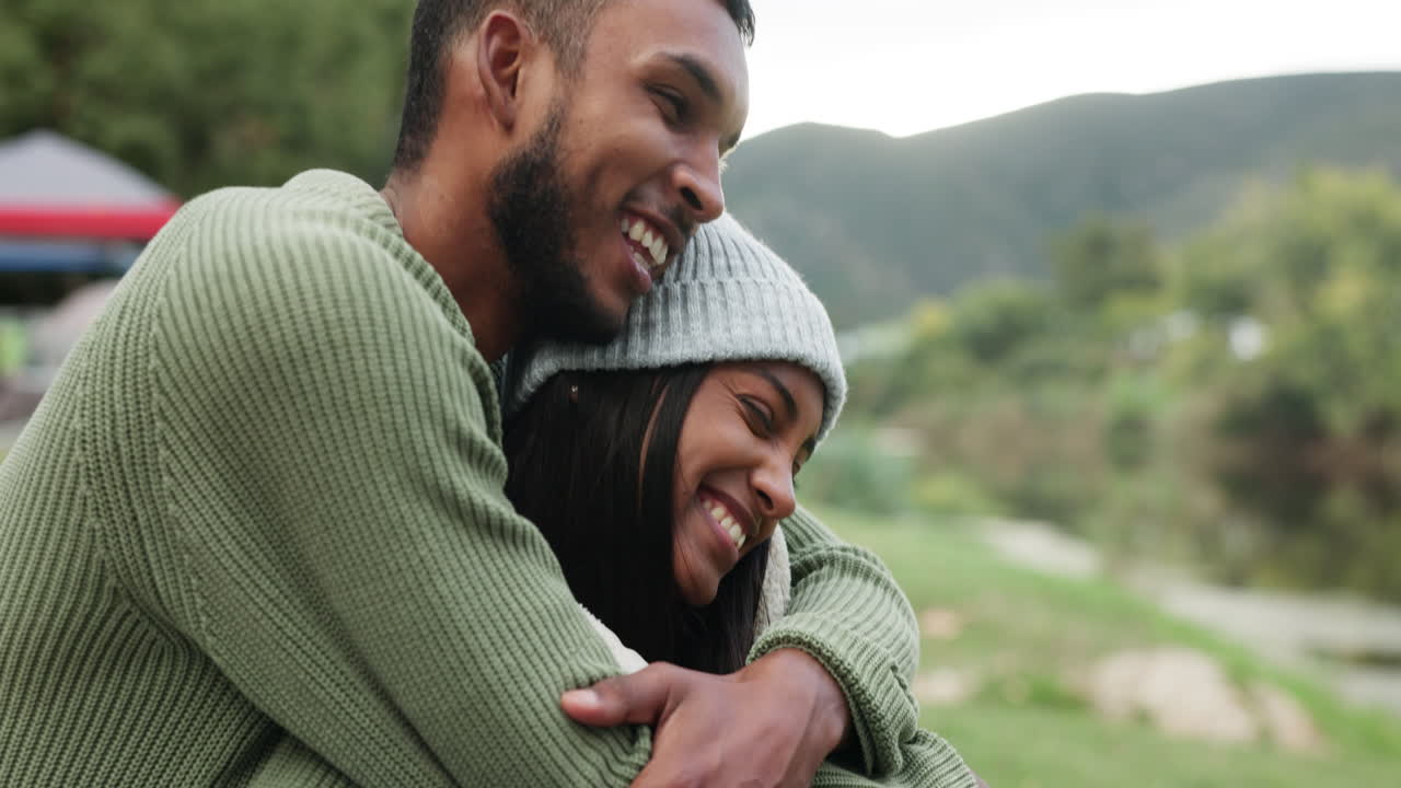 Couple, hug and happiness at camp in nature