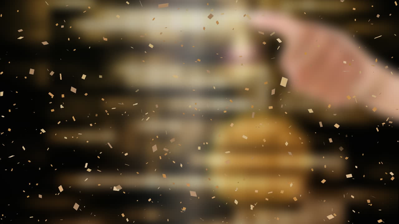 Animation of falling confetti over brown background