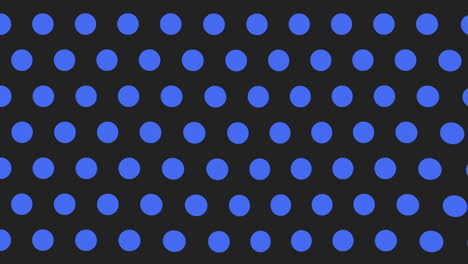 symmetrical blue polka dot pattern on black background