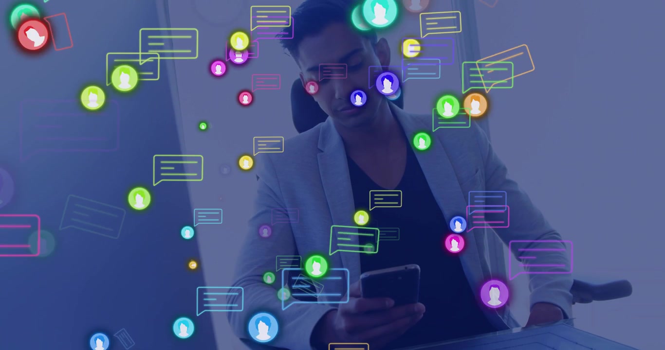 Noticing floating icons rising, Indian man tapping phone to check messages at desk in light blazer