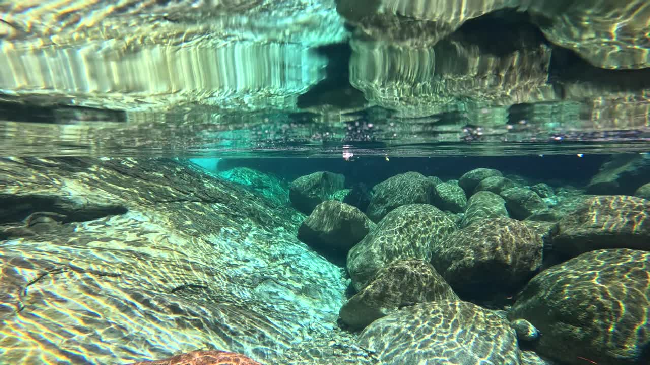 Clear river, underwater photography, light and shadow flowing with the waves, very beautiful