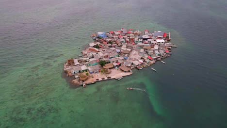 boat arriving to most constructed island in the world in colombia