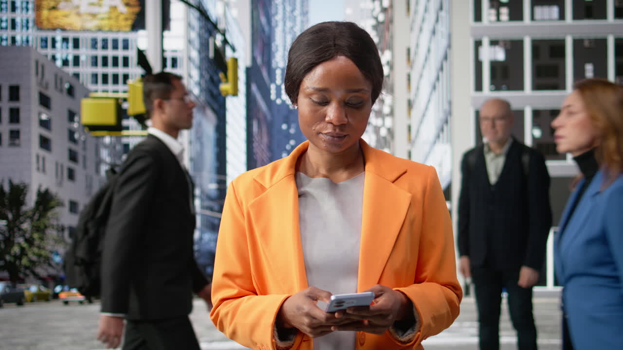Portrait of businesswoman walking with phone in hand along business district