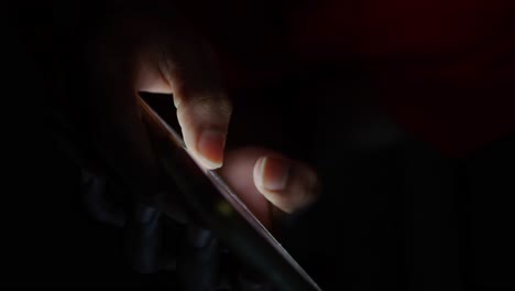 person using smartphone at night