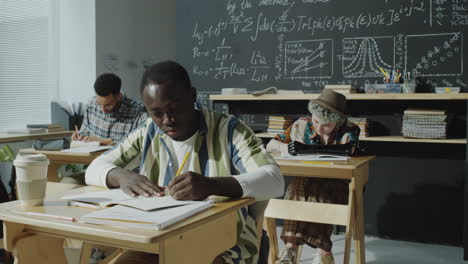 diverse students studying in a classroom