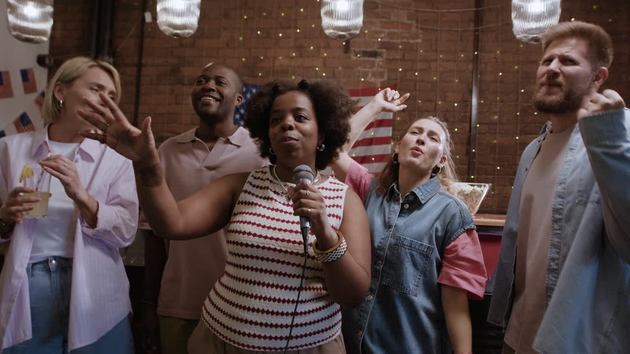 Friends Singing Karaoke at a Party