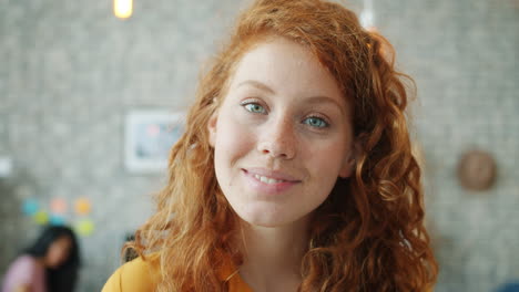 young woman smiling in office