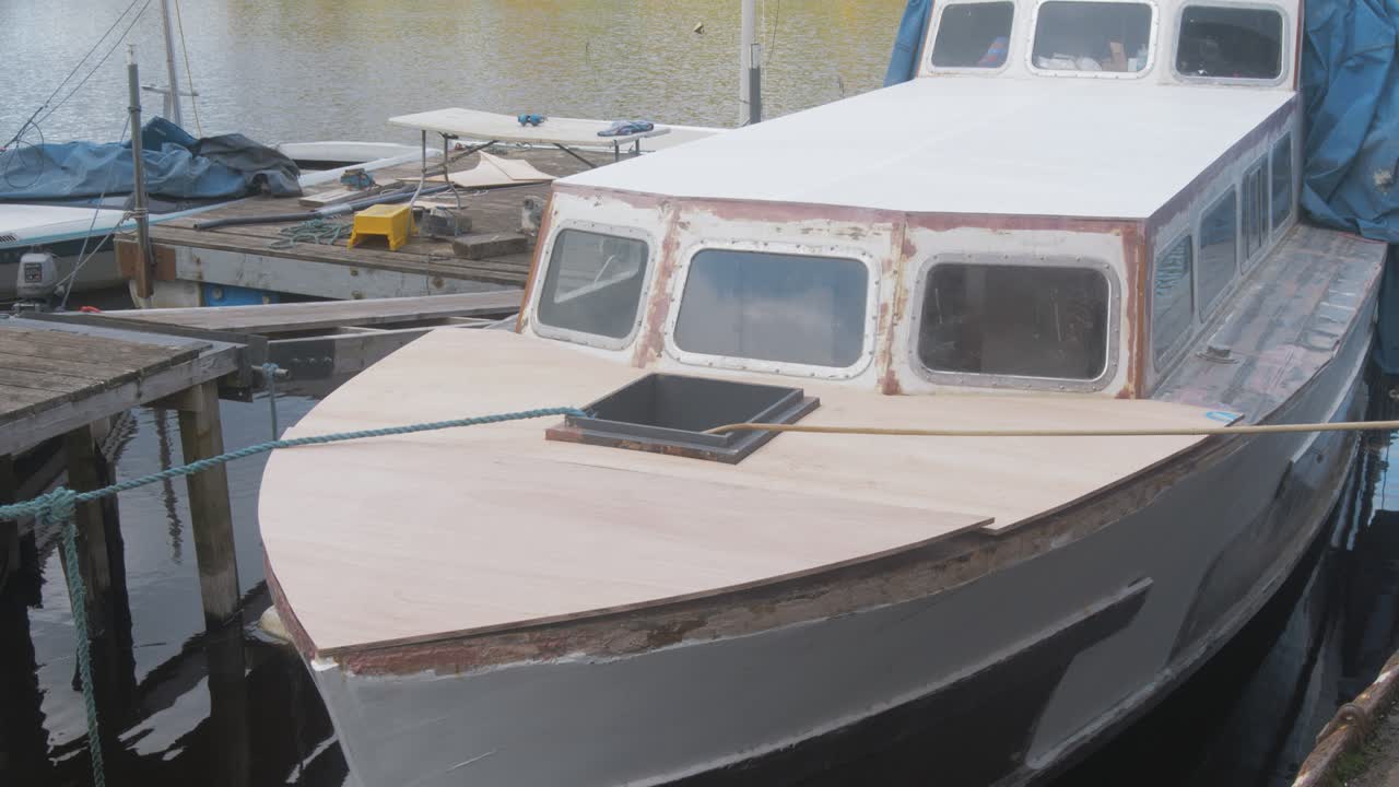 New plywood sheeting deck of wooden boat repair project