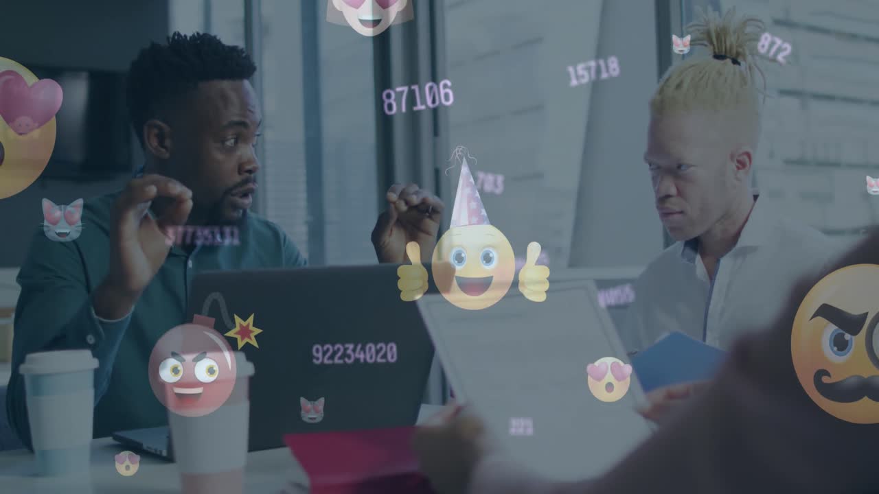 Animation of changing numbers and fame emojis icons over two diverse men discussing at office