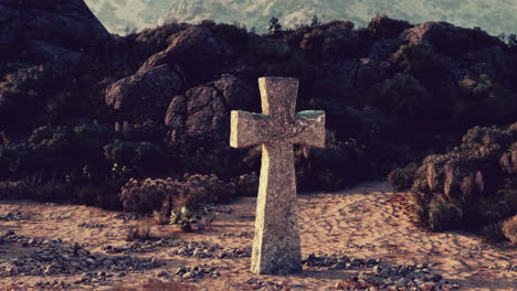 stone cross in desert landscape